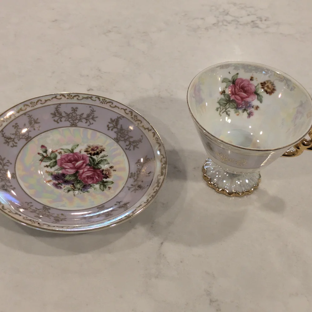 Elegant Floral Teacup and Saucer Set with Gold Accents